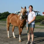 Dr. Geick's daughter poses for a picture with her show and dressage horse